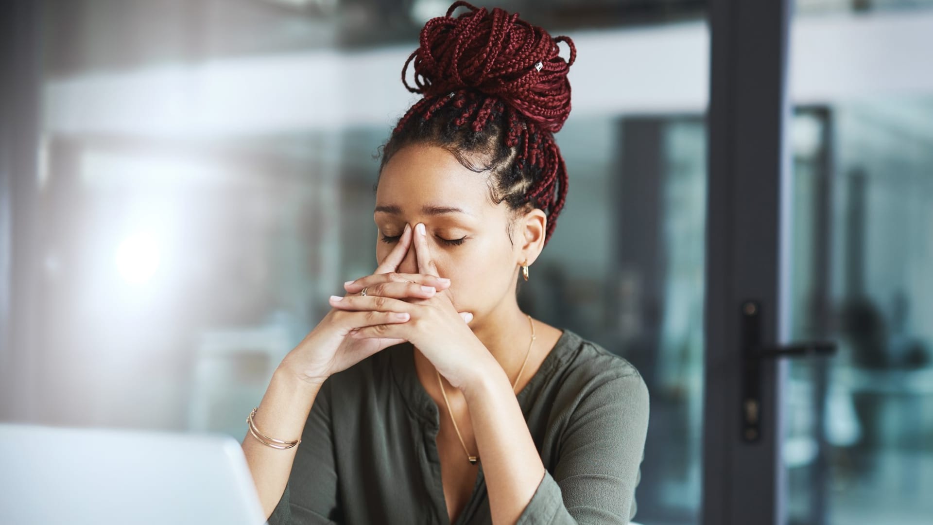 Stressed adult experiencing workplace anxiety while managing professional responsibilities and daily demands