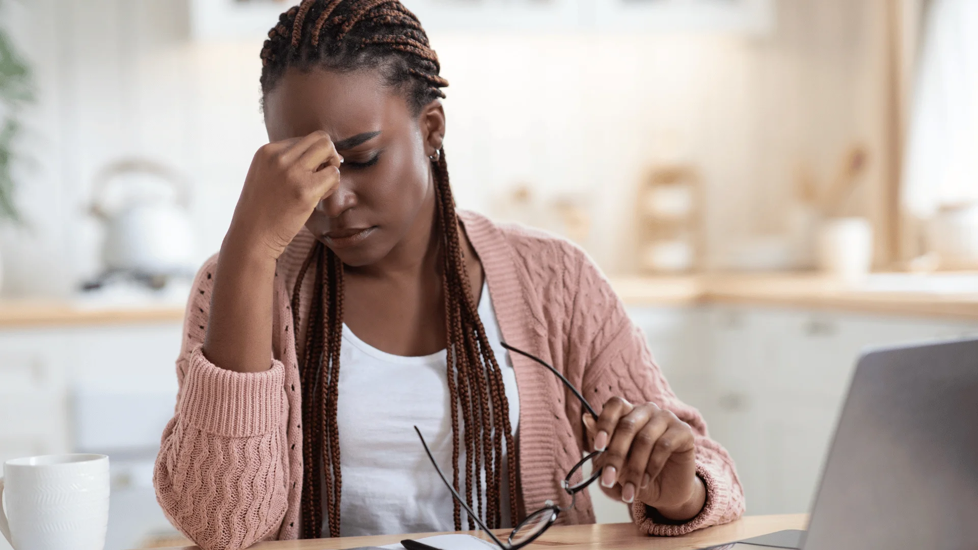 Woman overwhelmed by stress and anxiety while experiencing emotional strain & considering professional mental health support