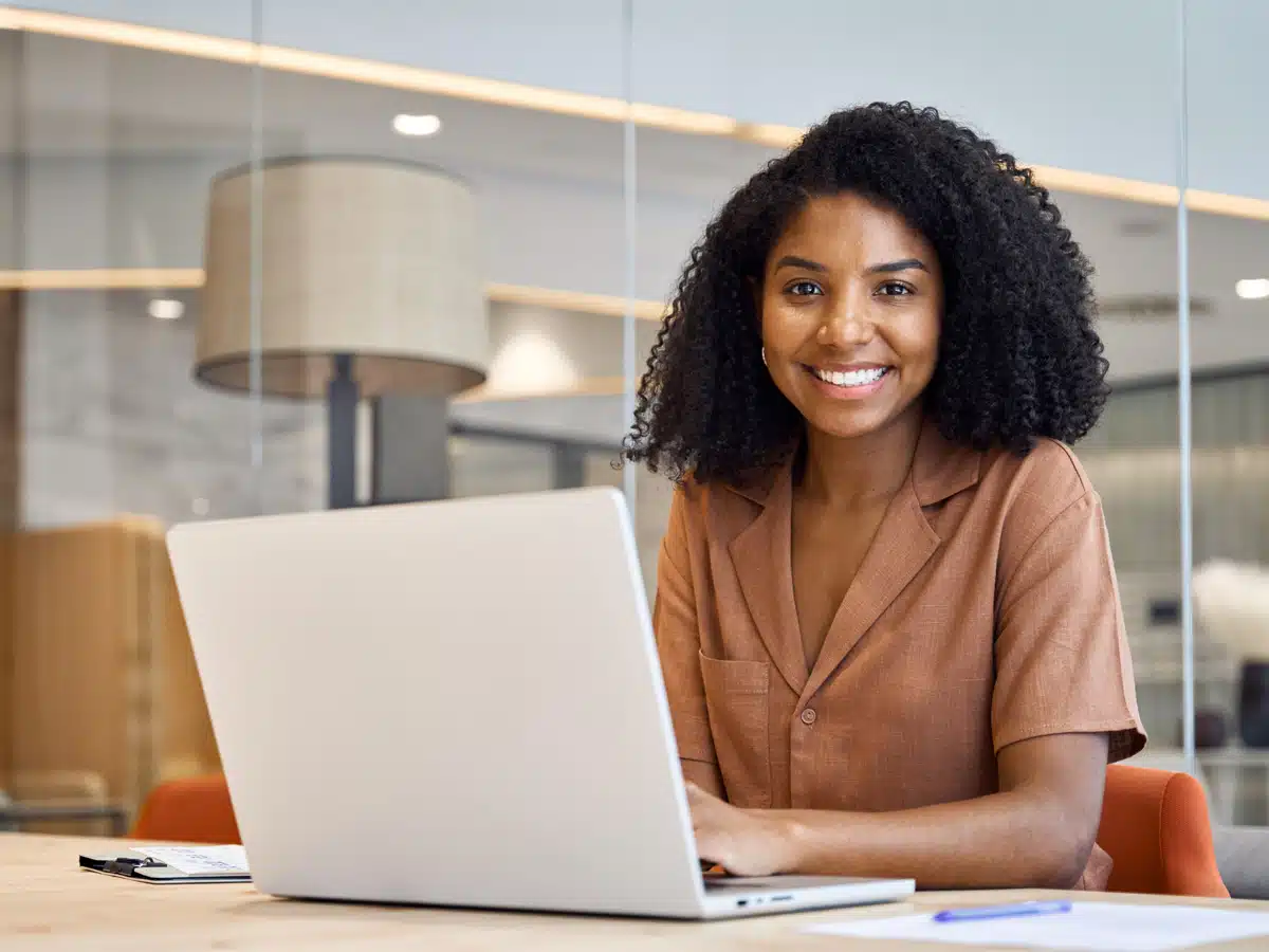 Smiling woman enjoying a positive moment focused on emotional health, happiness, and personal wellness