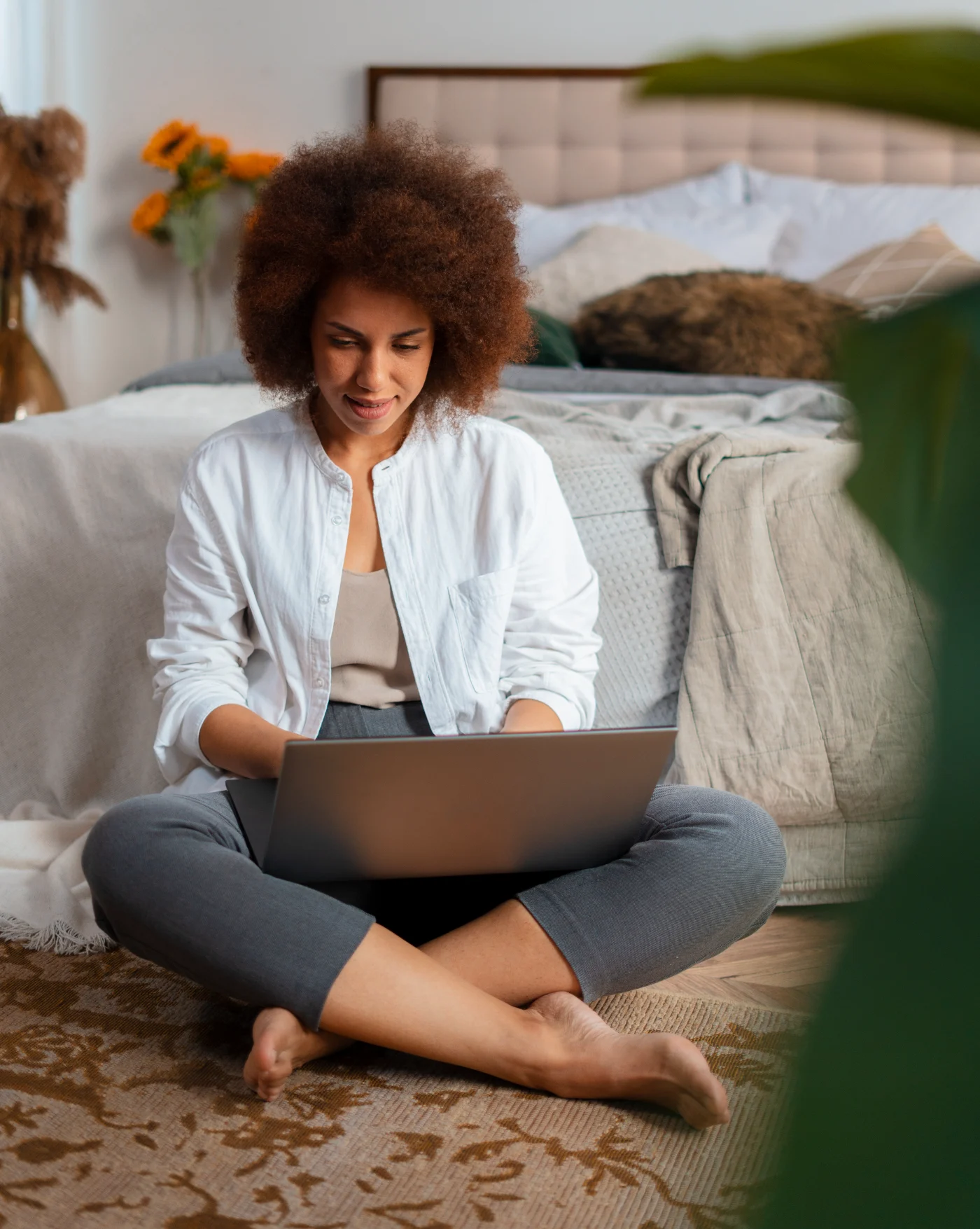 Woman holding a bouquet of flowers and enjoying peaceful moment that reflects relaxation, positivity, and emotional wellness